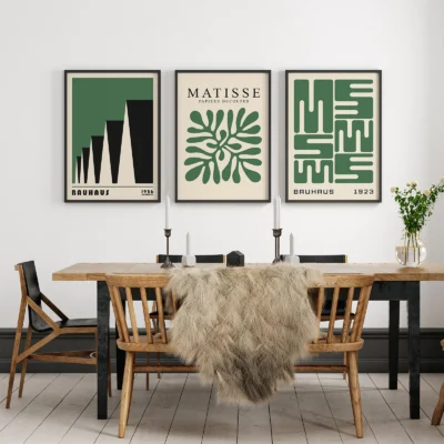 Gallery frame wall set with green Bauhaus posters in dining room