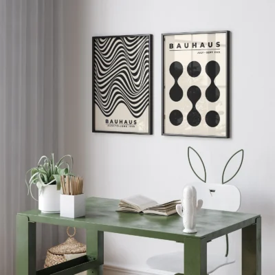 Bauhaus poster duo with waves and dots above green table setup