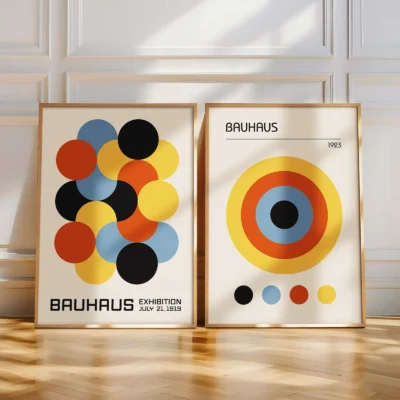 Two colorful Bauhaus posters with circle patterns in natural light