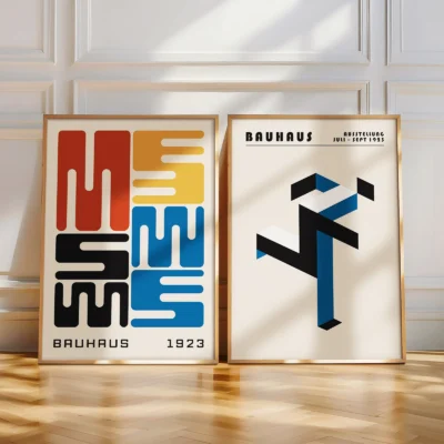 Two posters with abstract design and typographic elements in warm sunlight