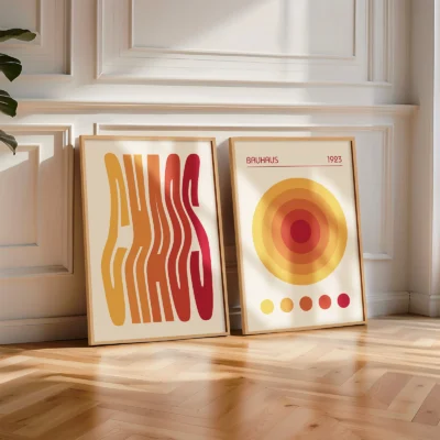 Red and yellow Bauhaus prints leaning on white interior wall