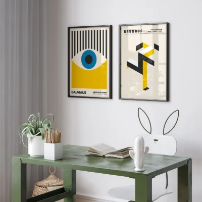 Bauhaus art print set above a green console with modern decor.