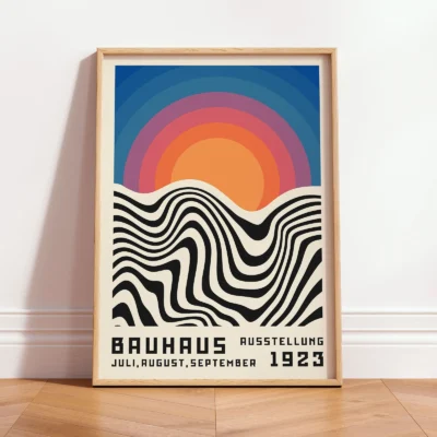 Vintage poster art print leaning framed against wall in bright room