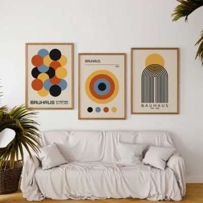 Colorful abstract Bauhaus set poster above white sofa with plants