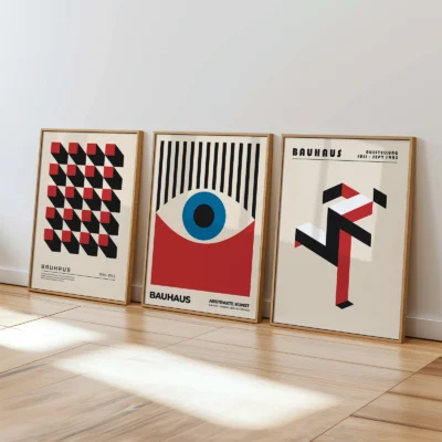 Abstract Bauhaus posters set resting on floor in bright, modern room