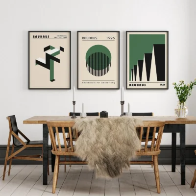 Bauhaus print set above dining table with natural wood tones