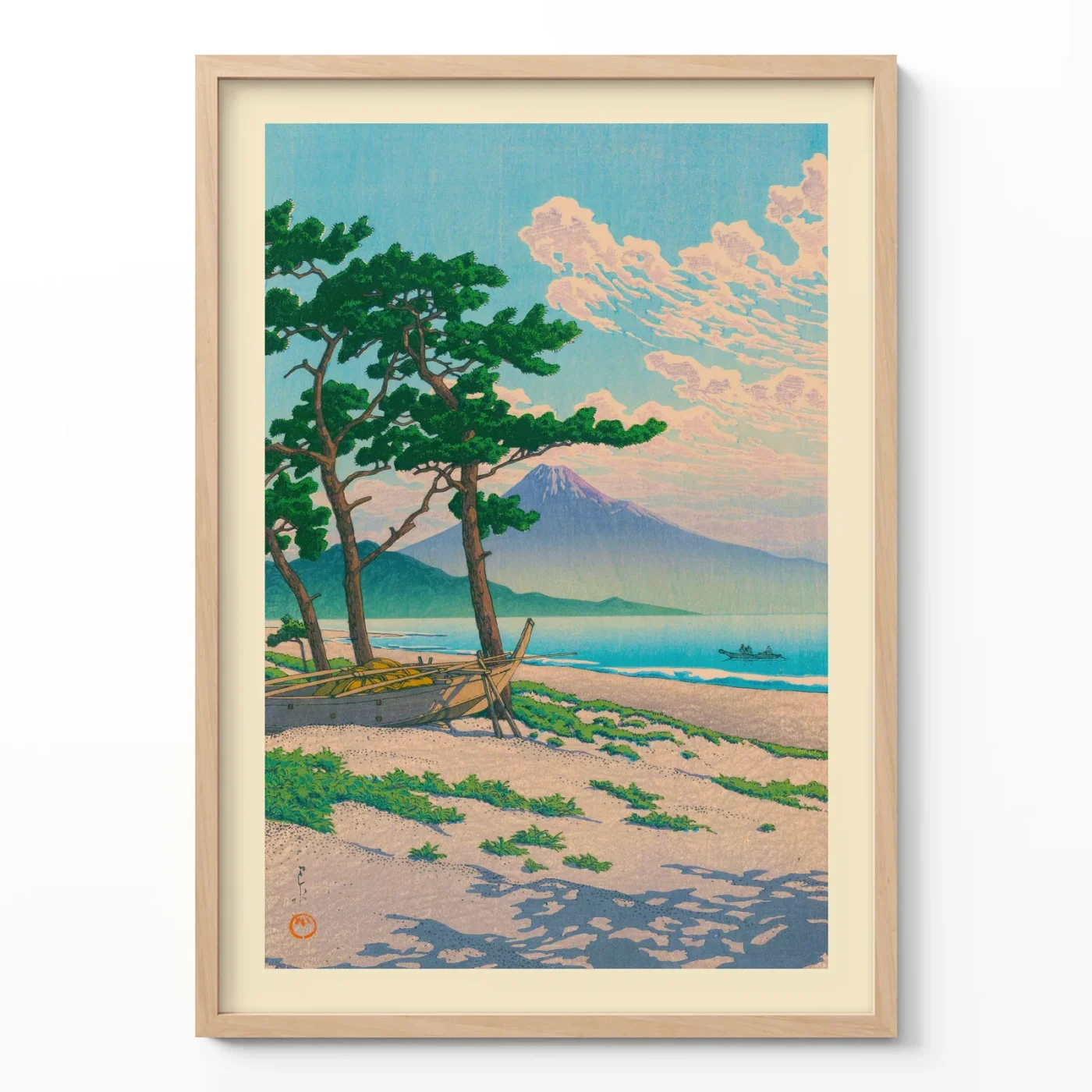 Hasui Kawase art showing pine trees on beach with Mt. Fuji in wooden frame on cream background