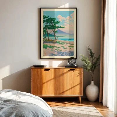 Hasui Kawase art hanging above wooden sideboard, showing beach and pine trees at sunset