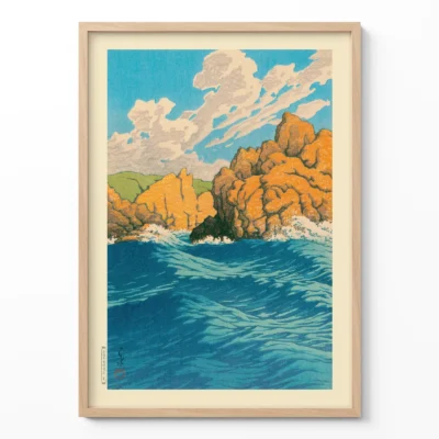 Hasui Kawase artwork showing rocky Japanese coastline and deep blue sea in wooden frame
