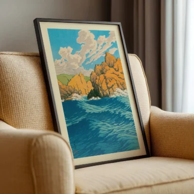 Hasui Kawase artwork resting on beige armchair, Japanese coastal scene in vivid colors