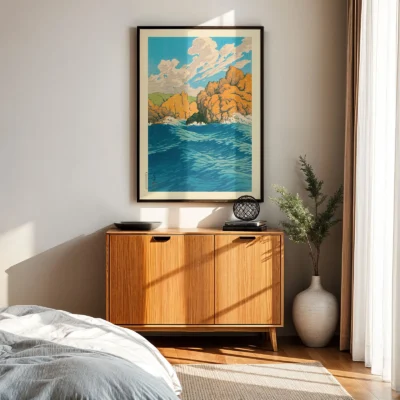 Hasui Kawase artwork above wooden cabinet, ocean and cliffs under natural sunlight