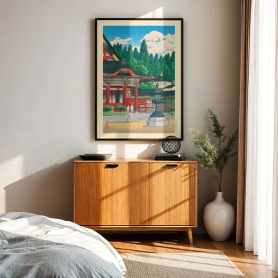 Kawase Hasui art above wooden cabinet, framed Kuon Temple print in natural daylight