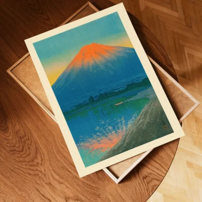 Unframed Japanese print of Mount Fuji sunrise scene placed on wooden tray
