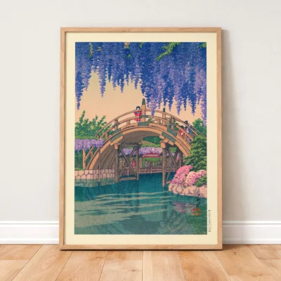 Japanese woodblock print leaning on wall, wisteria-covered bridge with calm water below