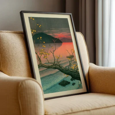 Angled framed Hasui Kawase lake poster resting on armchair