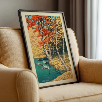 Side view of Hasui framed autumn print on a chair