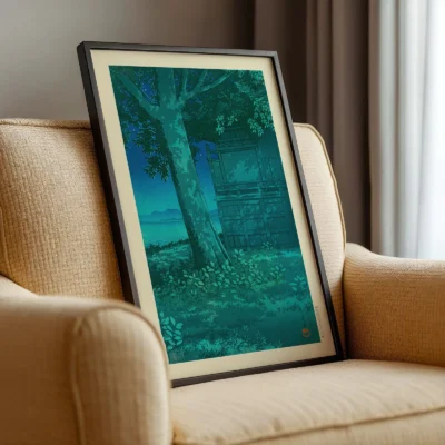 Side view of framed Kawase Hasui lagoon print resting on chair