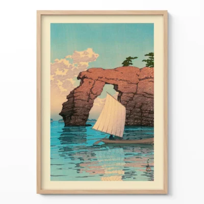 Framed Hasui wall print of sailboat near red cliff island